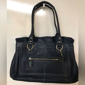 Navy blue Coach genuine leather purse.